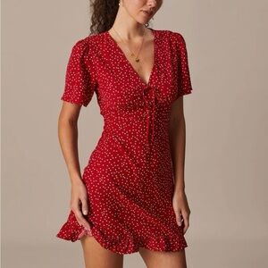 The Red V Neck Polka Dot Flounce Mini Dress.